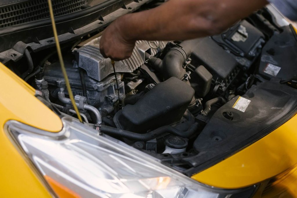 remaps bournemouth 6 mechanic checking car engine oil